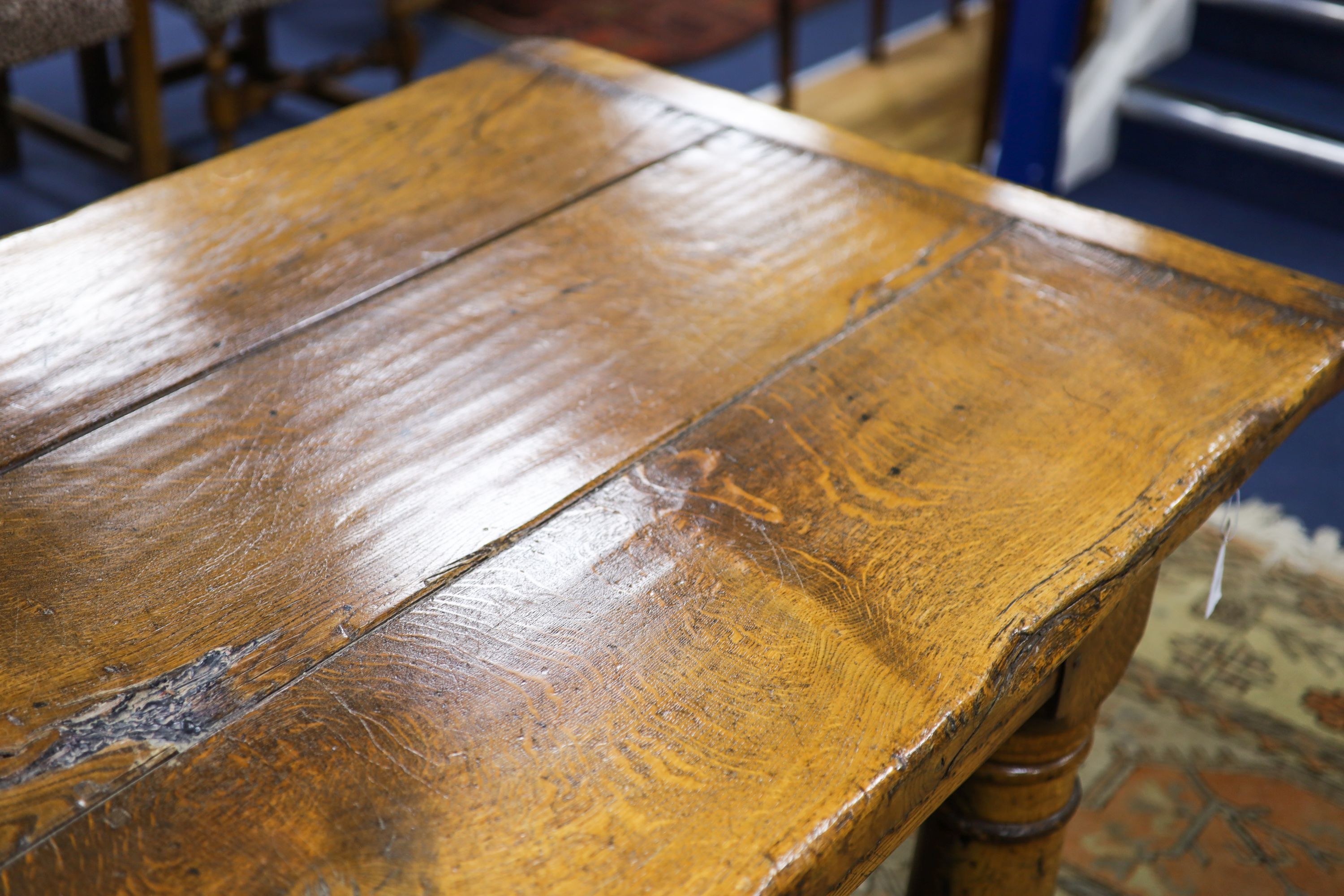 An 18th century style pale oak refectory dining table, length 305cm, depth 90cm, height 76cm